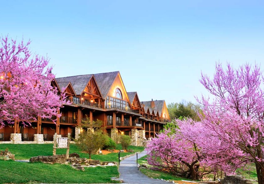 Falls Lodge with blooming Redbud trees during Spring at Big Cedar Lodge.