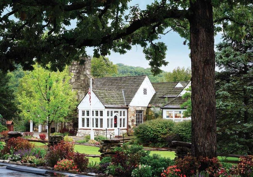 The Worman House nestled in trees and greenery